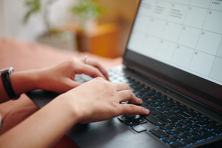 Typing on Laptop Keyboard while Viewing Calendar Screen